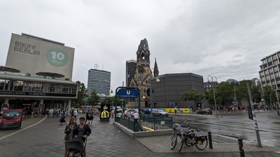 An old church is shown in the center and half of the conic tower is cut off in a tilted manner